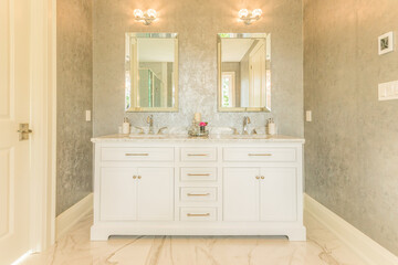 Fototapeta na wymiar Contemporary staged luxury bathroom vanity marble floors