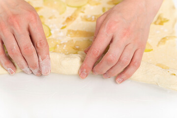 Chef prepares an apple roll. Process of making an apple dessert.