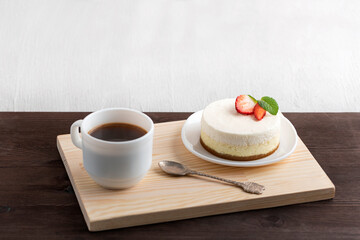 Cake and coffee on wooden tray. Breakfast in bed.