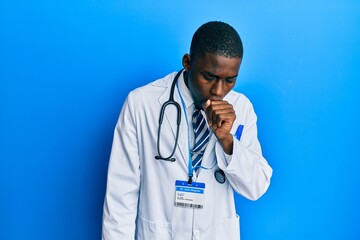 Young african american man wearing doctor uniform feeling unwell and coughing as symptom for cold or bronchitis. health care concept.