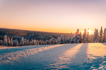 Beautiful winter nature landscape, amazing mountain view of sunset. Scenic image of snowy woodland.