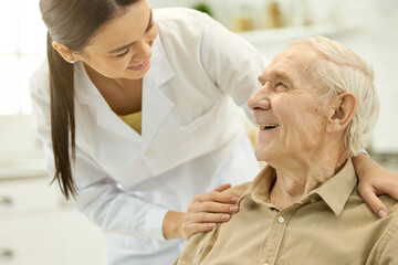 Trusted medical personnel acting supportive towards senior patient