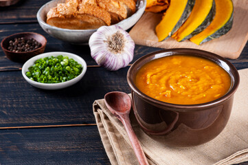 .Pumpkin cream made at home, accompanied by toast. Copy space