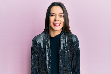 Fototapeta premium Young hispanic girl wearing party jacket with a happy and cool smile on face. lucky person.