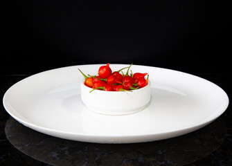 Biquinho pepper isolated oh the white plate