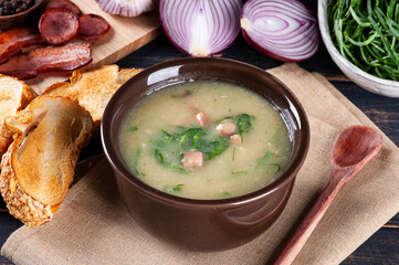 Popular dish of Portuguese cuisine called Caldo Verde. Made with potatoes, bacon, pepperoni sausage...