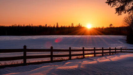 Naklejka na ściany i meble Sunset on winter farmland