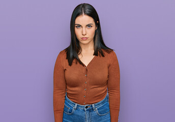 Young hispanic woman wearing casual clothes skeptic and nervous, frowning upset because of problem....