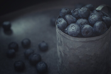 Juicy blueberries on a dark background