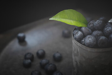 Juicy blueberries on a dark background