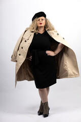 mature plus size model woman wearing black clothes and trench coat, xxl woman on white background