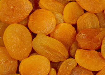 a close-up with many dehydrated apricot fruits