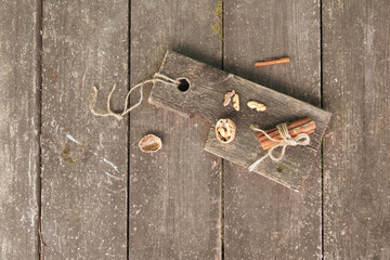 Pieces of walnut cinnamon sticks on a wooden board. High quality photo