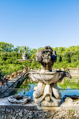 Fototapeta na wymiar A statue in the Isolotto, an oval-shaped island with the Fountain of the Ocean in the middle, in Boboli Gardens, beside Palazzo Pitti, Florence city center, Tuscany region, Italy