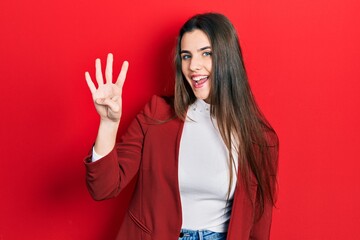 Young brunette teenager wearing business jacket showing and pointing up with fingers number four while smiling confident and happy.