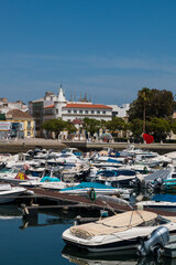 FARO, PORTUGAL - SEPTEMBER 8, 2020: colorful boats in the old harbor of Faro Marina, Portugal.