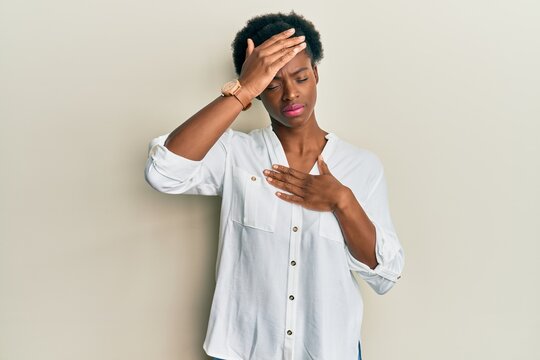 Young african american girl wearing casual clothes touching forehead for illness and fever, flu and cold, virus sick