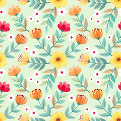 Colorful hand drawn flowers seamless pattern design on light green background for fabric, textile, and wallpaper.