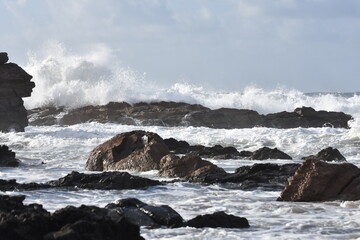Fototapeta na wymiar The sea demonstrating its power against the cliffs
