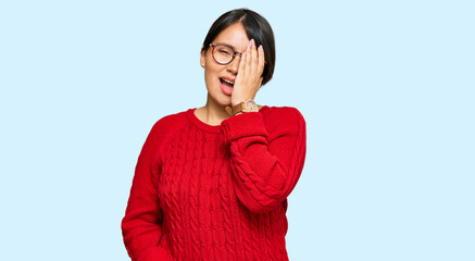Young beautiful hispanic woman with short hair wearing casual sweater and glasses yawning tired...