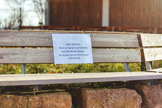 Closed Beer Garden Of Restaurant In Germany With Restriction Sign, Closed Due To Covid 19 Or Corona, Food To Take Away