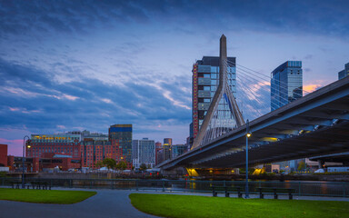 Boston Skyline Nightscape with Suspension Bridge over the Green River Bank