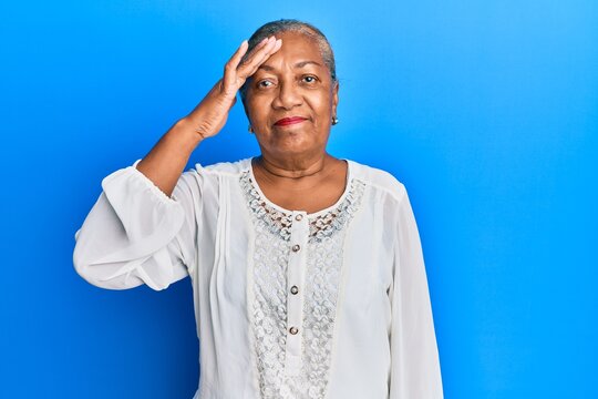 Senior african american woman wearing casual clothes surprised with hand on head for mistake, remember error. forgot, bad memory concept.