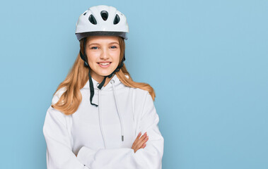 Beautiful young caucasian girl wearing bike helmet happy face smiling with crossed arms looking at the camera. positive person.