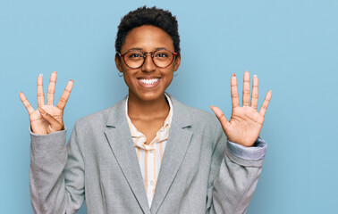 Young african american woman wearing business clothes showing and pointing up with fingers number...