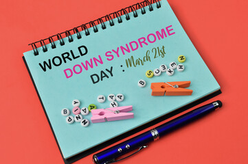 Notebook written with text WORLD DOWN SYNDROME DAY on March 21st