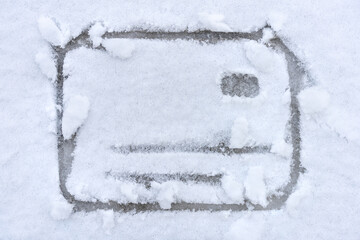 The credit card is drawn in the snow. The concept of online shopping.