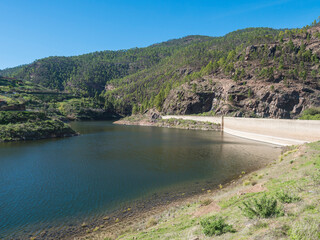 Fototapeta na wymiar View of sweet water dam Presa de Los Perez lake in Tamadaba nature park. Gran Canaria, Canary Islands, Spain