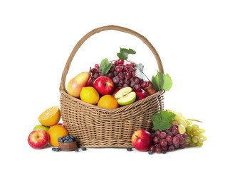 Wicker basket with different fruits and berries on white background