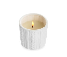 Burning wax candle in holder on white background