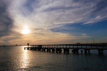 Fototapeta na wymiar Sunrise and Cloudscape over the Pier