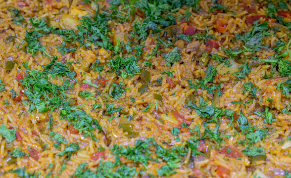 Biryani (also known as biriyani, biriani, birani or briyani).Biryani garnished with coriander leaves texture image