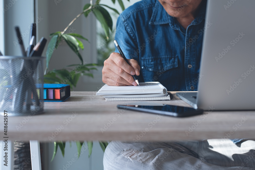 Sticker working from home, business man in smart casual wear online working on laptop computer from home off