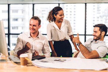 Group of professional business meeting and discussing strategy with new startup project.Creative business people planning and brainstorm with desktop computer in modern office.Teamwork concept