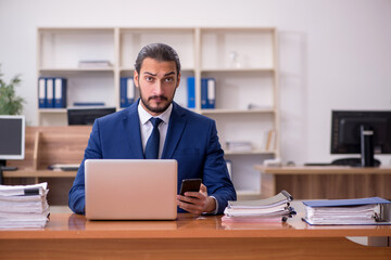 Young businessman employee working at workplace