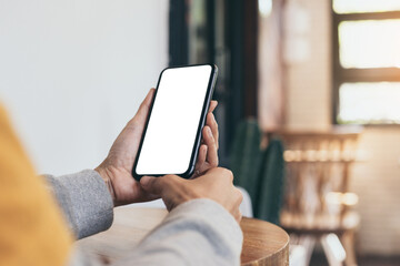 cell phone blank white screen mockup.woman hand holding texting using mobile on desk at office.background empty space for advertise.work people contact marketing business,technology