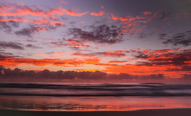 Naklejka na ściany i meble Beautiful sunrise over the Pacific Ocean in Pottsville, NSW, Australia