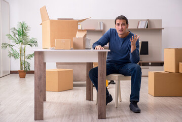 Fototapeta premium Young man moving to new flat