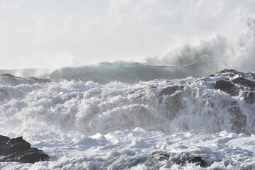 The sea demonstrating its power against the cliffs