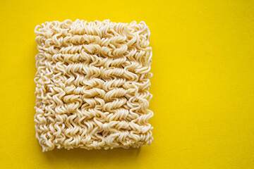 Noodles on a plate. Vermicelli in the shape of a square on a round plate.