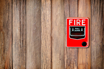 Fire break glass switch on  Wooden wall background