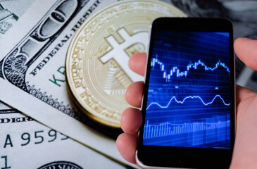 Bitcoin and cryptocurrency investing concept. Mobile phone application to trade Bitcoin BTC in...