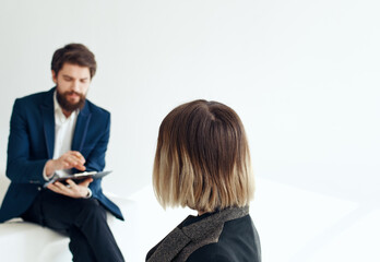 Women and men in suits In the bright room of interviews hiring
