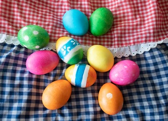 Colorful Easter eggs on a plaid towel 