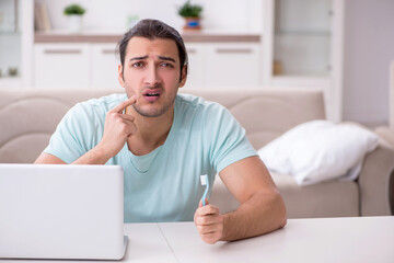 Young man suffering from toothache