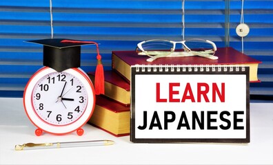 Learn Japanese. The inscription of the text on the notepad. The study of the sign system of speech...